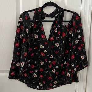 Black cold shoulder shirt with red and white flower detailing